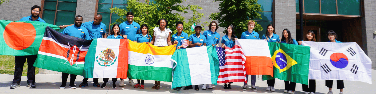 ISSS student ambassadors holding the flags of their home countries